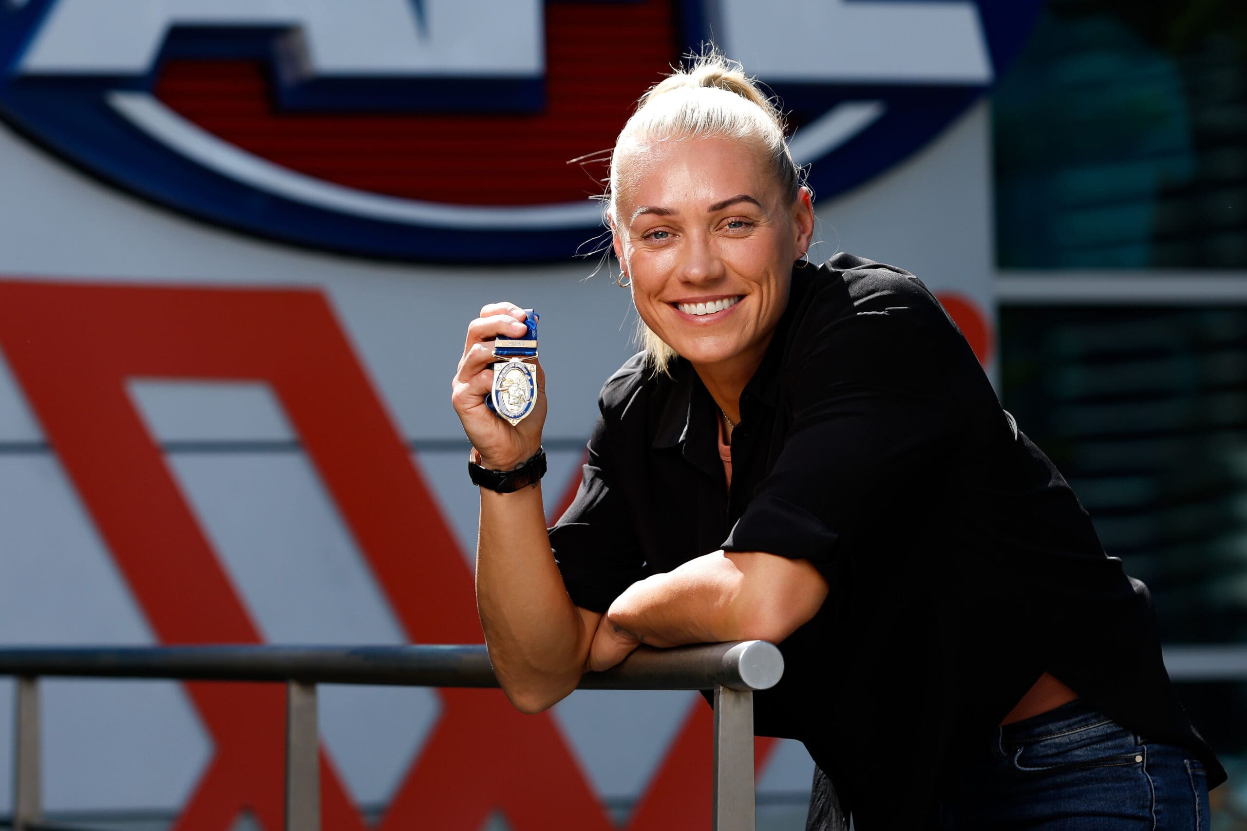 AFLW stars with a basketball background