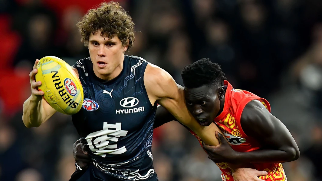 Mac Andrew tackles Charlie Curnow during Gold Coast's clash against Carlton in round 11, 2024. Picture: AFL Photos