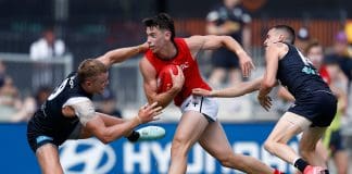 MELBOURNE, AUSTRALIA - FEBRUARY 22: Hugh Boxshall of the Saints fends off Patrick Cripps of the Blues during the 2025 AFL match simulation between the Carlton Blues and St Kilda Saints at Ikon Park on February 22, 2025 in Melbourne, Australia. (Photo by Michael Willson/AFL Photos via Getty Images)