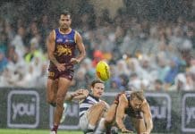 BRISBANE, AUSTRALIA - APRIL 20: Tom Stewart of the Cats and Kai Lohmann of the Lions in action during the 2024 AFL Round 06 match between the Brisbane Lions and the Geelong Cats at The Gabba on April 20, 2024 in BRISBANE, Australia. (Photo by Russell Freeman/AFL Photos via Getty Images)