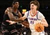 COLUMBIA, SOUTH CAROLINA - JANUARY 22: Alex Condon #21 of the Florida Gators drives to the basket against Nick Pringle #5 of the South Carolina Gamecocks during the second half at Colonial Life Arena on January 22, 2025 in Columbia, South Carolina. (Photo by Isaiah Vazquez/Getty Images)