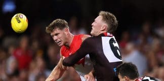 SYDNEY, AUSTRALIA - MARCH 07: Taylor Adams of the Swans is tackled by James Sicily of the Hawks during the AFL Opening Round match between Sydney Swans and Hawthorn Hawks at Sydney Cricket Ground, on March 07, 2025, in Sydney, Australia. (Photo by Cameron Spencer/Getty Images)